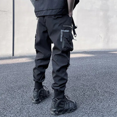 SCHWARZE CARGO HOSE MIT SEITLICHEN REFLEXIONSTASCHEN